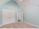 Carpeted bedroom boasts a tall ceiling, closet and an ensuite bathroom at 805 River Valley Dr, Dacula, GA 30019