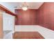 Formal dining area features hardwood floors, decorative wallpaper and ornate chandelier at 805 River Valley Dr, Dacula, GA 30019