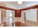 Elegant dining room featuring hardwood floors, stylish wallpaper and decorative support columns at 805 River Valley Dr, Dacula, GA 30019