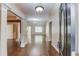 Open foyer featuring hardwood floors and detailed columns leading into a spacious living area at 805 River Valley Dr, Dacula, GA 30019