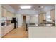 Spacious kitchen features stainless steel appliances, granite countertops, and custom cabinetry at 805 River Valley Dr, Dacula, GA 30019