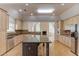 Beautiful kitchen featuring granite countertops, stainless steel appliances, and a center island at 805 River Valley Dr, Dacula, GA 30019