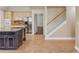 Open kitchen with a center island and staircase access at 805 River Valley Dr, Dacula, GA 30019