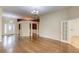 Open floor plan, hardwood floors, decorative columns that seamlessly connects living spaces at 805 River Valley Dr, Dacula, GA 30019