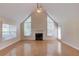 Bright living room features cathedral ceiling, fireplace, and large windows at 805 River Valley Dr, Dacula, GA 30019
