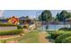 Community tennis courts with playground, green space, and a sidewalk entrance at 805 River Valley Dr, Dacula, GA 30019