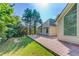 Brick paver patio with views of the house and lush yard with mature trees at 805 River Valley Dr, Dacula, GA 30019