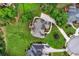 Aerial view showcases the property with manicured landscaping and circular driveway at 106 April Walk, Mcdonough, GA 30253