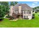 Spacious backyard featuring a large deck, stairs, and ample green space, perfect for outdoor gatherings at 106 April Walk, Mcdonough, GA 30253