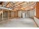 Spacious unfinished basement with concrete floors and insulated ceiling, ready for customization and features a window and refrigerator at 106 April Walk, Mcdonough, GA 30253