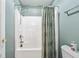 Bathroom featuring a shower with a patterned curtain, toilet, and white shower stall at 106 April Walk, Mcdonough, GA 30253