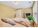Bedroom featuring beige walls, plush bedding, and a window offering natural light at 106 April Walk, Mcdonough, GA 30253