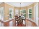 Bright breakfast nook with hardwood floors, with natural light from large windows at 106 April Walk, Mcdonough, GA 30253