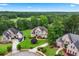 Stunning two-story home boasts lush landscaping, mature trees, and a sprawling green lawn at 106 April Walk, Mcdonough, GA 30253
