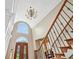 High angle of foyer featuring an elegant chandelier and beautiful entry at 106 April Walk, Mcdonough, GA 30253