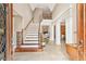 Grand foyer showcasing high ceilings, elegant staircase, and tiled floors at 106 April Walk, Mcdonough, GA 30253