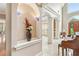 Elegant foyer with arched doorways, beautiful tile floor and piano at 106 April Walk, Mcdonough, GA 30253