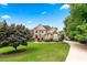 Beautiful two-story home with a well-manicured lawn and a long driveway leading to the property at 106 April Walk, Mcdonough, GA 30253