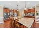 Beautiful kitchen with large island, stainless appliances and wood cabinetry at 106 April Walk, Mcdonough, GA 30253