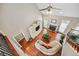 Bright living room featuring hardwood floors, a fireplace, built-in shelving, and a cozy white couch at 106 April Walk, Mcdonough, GA 30253