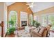 Bright living room with hardwood floors, a fireplace, and large windows providing natural light at 106 April Walk, Mcdonough, GA 30253