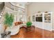 Open-concept living room boasts hardwood floors, a built-in entertainment center, and a second-floor view at 106 April Walk, Mcdonough, GA 30253