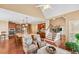 Inviting living space featuring hardwood floors, a staircase, and a kitchen at 106 April Walk, Mcdonough, GA 30253