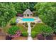 Inviting community pool with lounge chairs, a gazebo, and landscaped surroundings for relaxation and leisure at 106 April Walk, Mcdonough, GA 30253