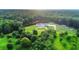 Sprawling property with a beautiful home, pond, manicured lawns, surrounded by lush trees at 1169 Hodges Cir, Mansfield, GA 30055
