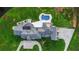 Aerial view showcasing the home's pool, patio, and extensive driveway at 1169 Hodges Cir, Mansfield, GA 30055