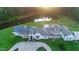 Aerial view of a luxury home with a pond and large lawn, perfect for outdoor enjoyment at 1169 Hodges Cir, Mansfield, GA 30055