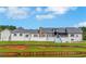 Spacious backyard with new gray roofing, an outdoor patio and an outdoor dining area at 1169 Hodges Cir, Mansfield, GA 30055