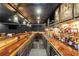 A home bar offers cabinets, lighting, and sink for all beverage-serving needs at 1169 Hodges Cir, Mansfield, GA 30055