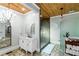 Bathroom showcasing a stone floors, glass shower, vanity with marble countertop, and wooden ceiling at 1169 Hodges Cir, Mansfield, GA 30055
