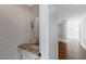 Modern half bathroom with stylish fixtures, subway tiles, and elegant vanity at 1169 Hodges Cir, Mansfield, GA 30055