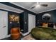 Cozy bedroom showcasing dark walls, carpet, and ceiling fan at 1169 Hodges Cir, Mansfield, GA 30055
