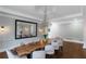 Elegant dining room with a chandelier, a live-edge table, and decorative lighting at 1169 Hodges Cir, Mansfield, GA 30055