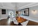 Elegant dining room with a chandelier, a live-edge table and ample seating at 1169 Hodges Cir, Mansfield, GA 30055