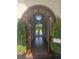 Arched wood doorway leads to a long entry hall with wood floors at 1169 Hodges Cir, Mansfield, GA 30055