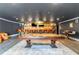 Spacious game room with a pool table, bar, and seating area, perfect for entertaining at 1169 Hodges Cir, Mansfield, GA 30055