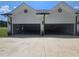 Attached three car garage with automatic doors and plenty of parking space at 1169 Hodges Cir, Mansfield, GA 30055