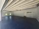 Clean, well-lit three-car garage featuring a pristine floor and ample room for storage at 1169 Hodges Cir, Mansfield, GA 30055