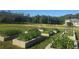 Established raised garden beds offer space for growing vegetables and herbs at 1169 Hodges Cir, Mansfield, GA 30055