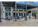 Stylish outdoor living space featuring a covered patio with comfortable seating and a dining area at 1169 Hodges Cir, Mansfield, GA 30055