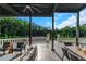 Elegant outdoor terrace with modern seating, offering scenic views of the landscaped backyard and lake at 1169 Hodges Cir, Mansfield, GA 30055