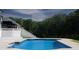 This sparkling backyard pool offers a serene outdoor experience for relaxation at 1169 Hodges Cir, Mansfield, GA 30055