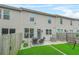 Townhome backyard featuring a patio with seating, stone landscape, and private fencing at 3246 Spicy Cedar Ln, Lithonia, GA 30038