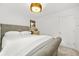 Comfortable bedroom features a gray upholstered bed and modern decor at 3246 Spicy Cedar Ln, Lithonia, GA 30038