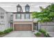 Charming two-story townhouse with a two-car garage and manicured landscaping, providing great curb appeal at 3246 Spicy Cedar Ln, Lithonia, GA 30038