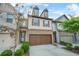 Inviting townhouse with a two-car garage, manicured landscaping, and a lovely front door at 3246 Spicy Cedar Ln, Lithonia, GA 30038